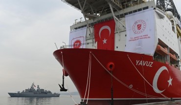 A picture taken at the port of Dilovasi, outside Istanbul, on June 20, 2019 shows the drilling ship 'Yavuz' scheduled to search for oil and gas off Cyprus, next to a warship.