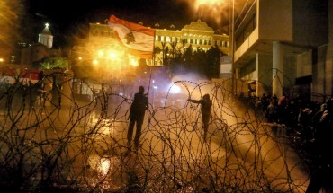 Riot policemen use water cannons to disperse anti-government protesters during clashes near the Grand Serail, headquarters of the Prime Minister of Lebanon. Photo: Marwan Naamani/dpa (Photo by Marwan Naamani/picture alliance via Getty Images)