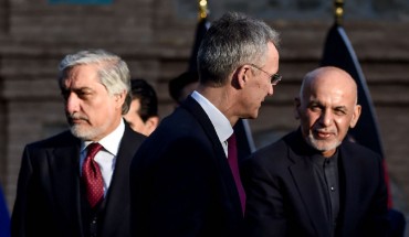 NATO Secretary General Jens Stoltenberg (C) arrives along with Afghanistan's President Ashraf Ghani (R) and Afghan presidential election opposition candidate Abdullah Abdullah ahead of a press conference at the presidential palace in Kabul on February 29, 2020.