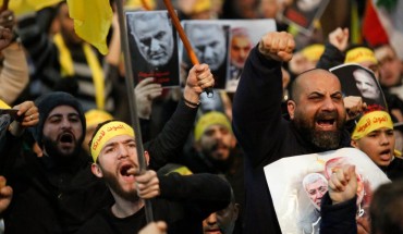 Supporters shout slogans during a rally for Qassem Soleimani in southern suburbs of Beirut, Lebanon, on Jan. 5, 2020. Hezbollah leader Sayyed Hassan Nasrallah urged on Sunday its fighters to attack U.S. soldiers in the region in retaliation for the assassination of Iranian top commander Qassem Soleimani by the United States. (Photo by Bilal Jawich/Xinhua via Getty) (Xinhua/ via Getty Images)