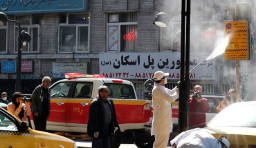 Iranian fire fighters and municipality workers disinfect a street in the capital Tehran for corona virus COVID-19 on March 5, 2020. 