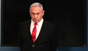 Israeli Prime Minister Benjamin Netanyahu arrives for a speech at his Jerusalem office on March 14, 2020, regarding the new measures that will be taken to fight the Corona virus in Israel.