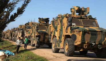 A Turkish military convoy is seen parked near the town of Batabu on the highway linking Idlib to the Syrian Bab al-Hawa border crossing with Turkey, on March 2, 2020. 
