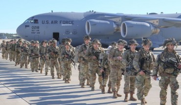 U.S. Army Paratroopers assigned to the 2nd Battalion, 504th Parachute Infantry Regiment, 1st Brigade Combat Team, 82nd Airborne Division, deploy from Pope Army Airfield, North Carolina on January 1, 2020. 