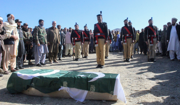 Security officials and relatives attend a funeral ceremony of a slain policeman, who was killed in an attack claimed by the Tehreek-e-Taliban Pakistan (TTP), in the border town of Chaman on January 28, 2022. (Photo by Abdul BASIT / AFP) (Photo by ABDUL BASIT/AFP via Getty Images)