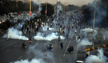 Pakistani security forces respond to protesters with tear gas as thousands of supporters of Pakistan's former Prime Minister Imran Khan took to the streets to protest against his disqualification by the election authority in Islamabad, Pakistan on October 21, 2022.