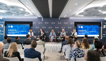 Image showing the panelists on the stage at MEI.