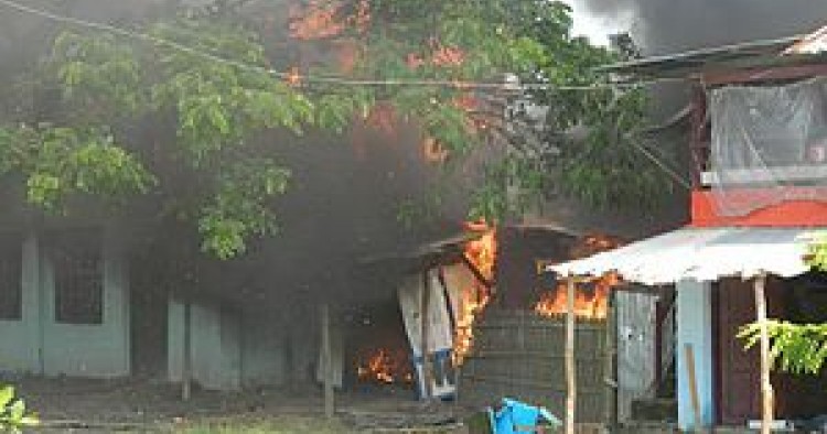 Rohinga village burning as they flee
