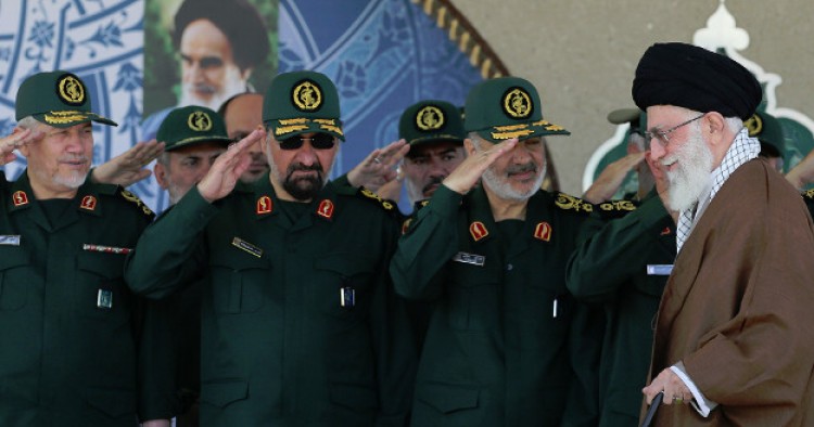 Iranian Guard troops salute 