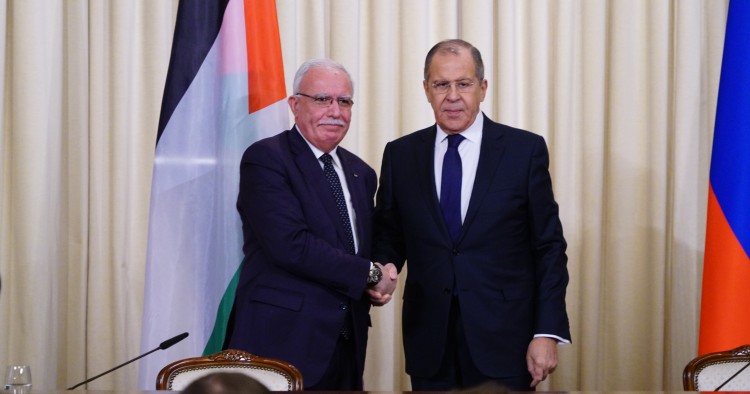 Russian Foreign Minister Sergei Lavrov (R) shakes hand with Palestinian Foreign Minister Riyad al-Malki (L) as they pose for a photo ahead of their press conference in Moscow, Russia on December 21, 2018.