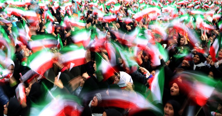 Iranian schoolgirls wave their national flag during celebrations in Tehran's Azadi Square (Freedom Square) to mark the 37th anniversary of the Islamic revolution on February 11, 2016.