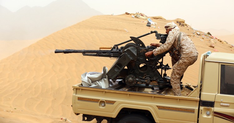 A Yemeni tribesman from the Popular Resistance Committees, supporting forces loyal to Yemen's Saudi-backed President, manoeuvrers a gun mounted on a pick up truck during fighting against Shiite Huthi rebels and their allies on June 30, 2017 in the area of Sirwah, west of Marib city.