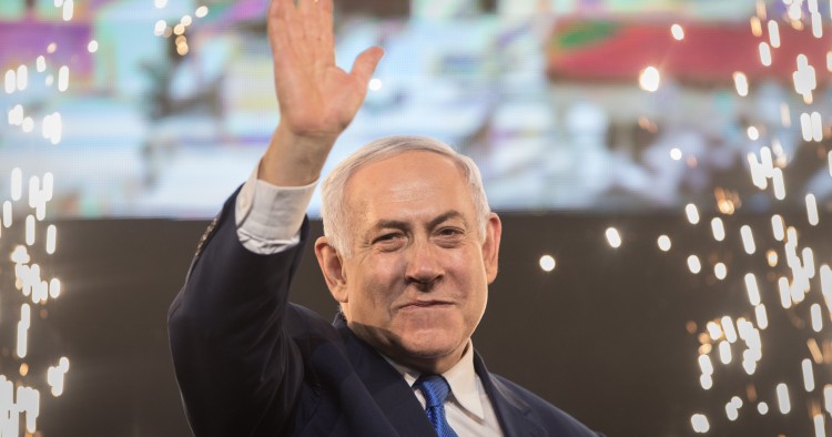  Benjamin Netanyahu, Prime Minister of Israel, beckons supporters after the polling stations have been closed.