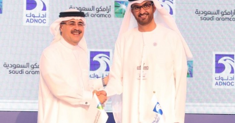 Sultan Ahmed al-Jaber(R), the director general and CEO of ADNOC, shakes hands with Saudi Aramco CEO Amin Nasser after signing a cooperation deal in Abu Dhabi on November 12, 2018.