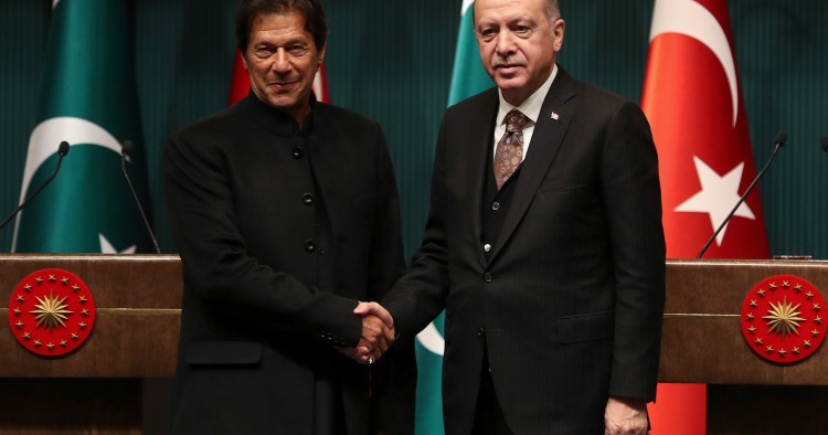 Turkish President Recep Tayyip Erdogan (R) and Pakistani Prime Minister Imran Khan (L) shake hands after a joint press conference at the Presidential Complex in Ankara, on January 4, 2019.