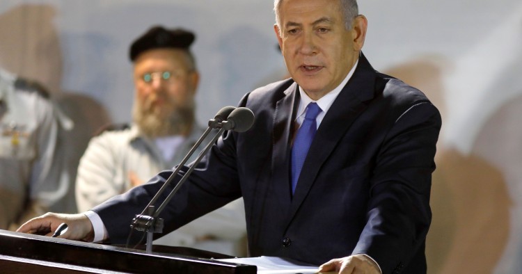 Prime Minister Benjamin Netanyahu (R) attends the funeral of Sergeant First Class Zachary Baumel at the Mount Herzl military cemetery in Jerusalem on April 4 2019.