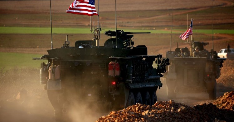 A convoy of US forces armoured vehicles drives near the village of Yalanli, on the western outskirts of the northern Syrian city of Manbij, on March 5, 2017