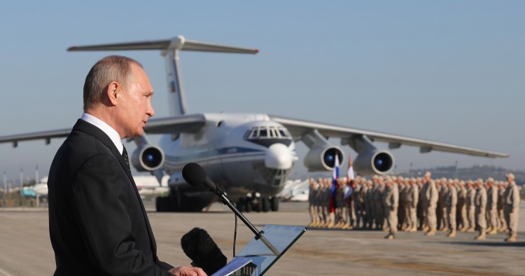 LATAKIA, SYRIA DECEMBER 11, 2017: Russia's President Vladimir Putin addresses Russian forces at the Russian Hmeimim air base. Putin has ordered Russian troops to start pulling out of Syria. Mikhail Klimentyev/Russian Presidential Press and Information Office/TASS (Photo by Mikhail Klimentyev\TASS via Getty Images)