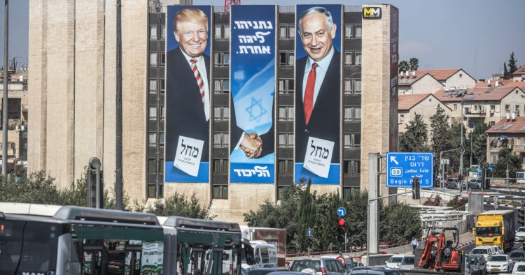 A general view of an election campaign banner depicting Israeli Prime Minister Benjamin Netanyahu (R), head of the Likud Party, shaking hands with US President Donald Trump, ahead of the snap Israeli legislative election, scheduled to take place on 17 September 2019