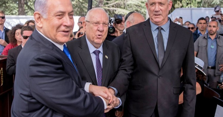 Israeli Prime Minister Benjamin Netanyahu (L), President Reuven Rivlin (C) and Benny Gantz, leader of Blue and White party, attend a memorial ceremony for late Israeli president Shimon Peres, at Mount Herzl in Jerusalem on September 19, 2019. 