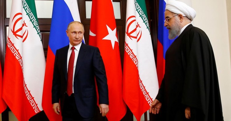 Russian President Vladimir Putin (L) and Iranian President Hassan Rouhani (R) attend the trilateral summit to discuss progress on Syria, between the Presidents of Turkey, Russia and Iran on November 22, 2017 in Sochi, Russia.