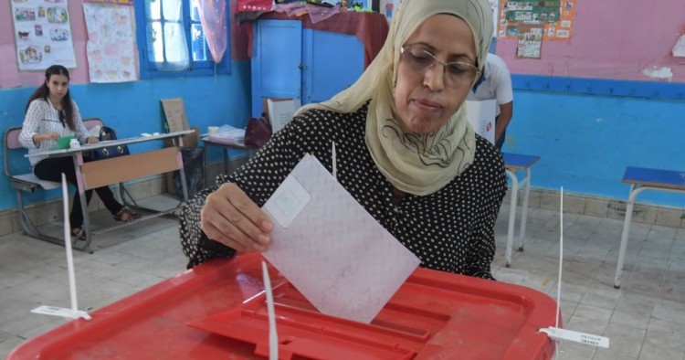 A Tunisian voter casts his ballot for presidential election at a polling station in La Marsa on the outskirts of the capital Tunis, on September 15, 2019.
