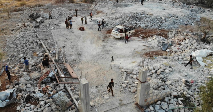 An aerial view taken on October 27, 2019 shows the site that was hit by helicopter gunfire which reportedly killed nine people near the northwestern Syrian village of Barisha in the Idlib province along the border with Turkey, where "groups linked to the Islamic State (IS) group" were present, according to a Britain-based war monitor with sources inside Syria. 