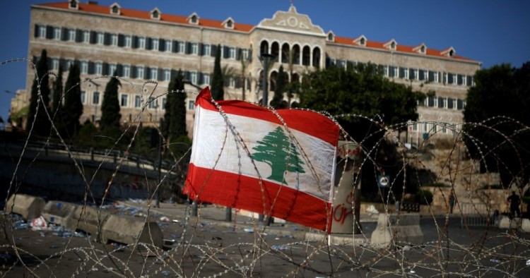 A Lebanese national flag fixed on barbed wire protecting the government headquarters, known as the Grand Serail, in central Beirut.
