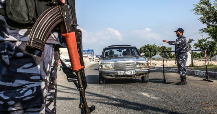 Security forces loyal to Palestinian Islamist movement Hamas stop a vehicle at a checkpoint in Khan Yunis in the southern Gaza Strip on August 28, 2019. 