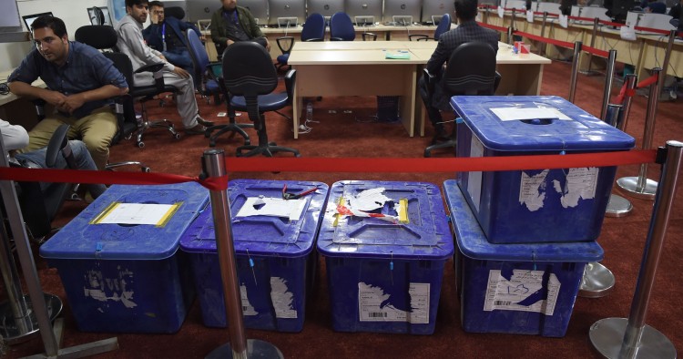 Independent Election Commission (IEC) workers sit at a computer terminal while election information from all over the country is gathered at the Data Centre in Kabul on October 2, 2019. - Voter participation in last weekend's Afghan presidential election will be much less than a third, the country's Independent Election Commission said on October 1, marking a record-low turnout. (Photo by WAKIL KOHSAR / AFP) (Photo by WAKIL KOHSAR/AFP via Getty Images)