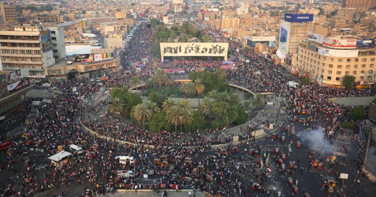 Iraqi demonstrators stand at Tahrir Square in Baghdad during ongoing anti-government demonstrations on October 28, 2019.