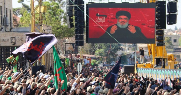 Shiite Muslims watch a televised speech by Hassan Nasrallah, the Lebanese Shiite Hezbollah movement leader, in the city of Baalbek in Lebanon's eastern Bekaa Valley on October 19, 2019.