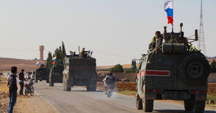 A convoy of Russian military vehicles drives toward the northeastern Syrian city of Kobane on October 23, 2019.