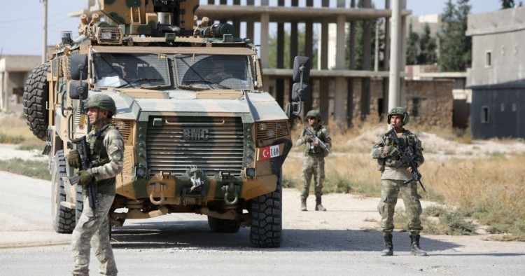 Turkish soldiers patrol the northern Syrian Kurdish town of Tal Abyad, on the border between Syria and Turkey, on October 23, 2019