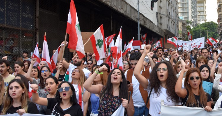 BEIRUT, LEBANON - NOVEMBER 03: People gather at Bechara El-Khoury Avenue to call protesters for them to continue the demonstrations until a new government formed as they march from Martyrs Square and Riyadh al-Solh Square in Beirut, Lebanon on November 03, 2019. (Photo by Mahmut Geldi/Anadolu Agency via Getty Images)