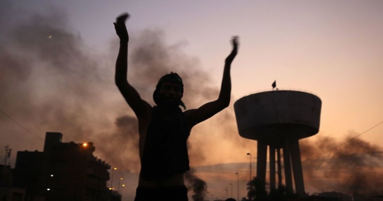 An Iraqi protester chants slogans during a demonstration against state corruption, failing public services and unemployment at Tayaran square in Baghdad on October 2, 2019.