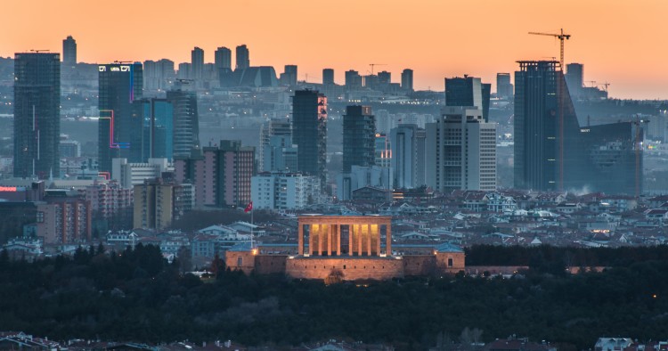 The sunset casts an orange sky over the new urban skyline of Turkey's capital city, Ankara, which is centered around the Anitkabir, the memorial tomb of the country's founding father Mustafa Kemal Ataturk.