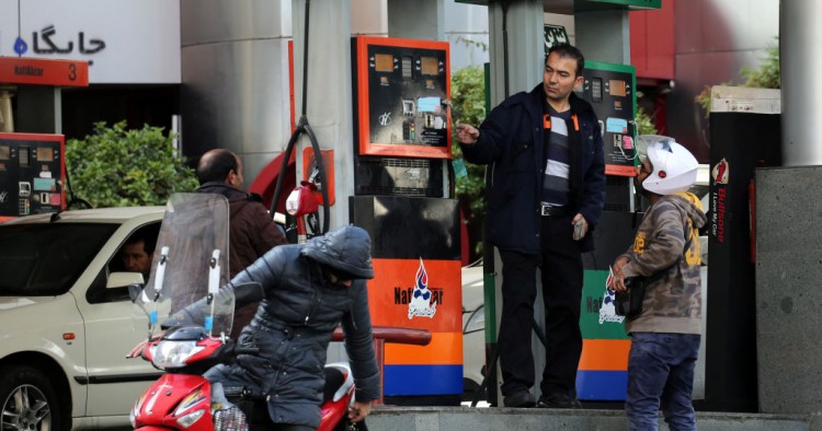 Iranians fill their vehicles at a petrol station in Tehran, on November 15, 2019.