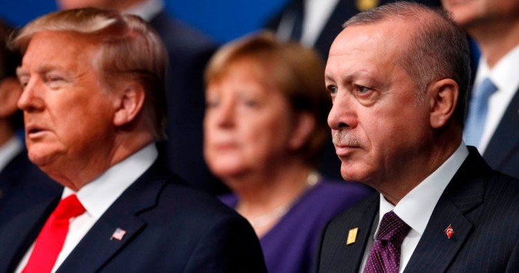 US President Donald Trump (L) and Turkey's President Recep Tayyip Erdogan (R) pose for the family photo at the NATO summit at the Grove hotel in Watford, northeast of London on December 4, 2019.