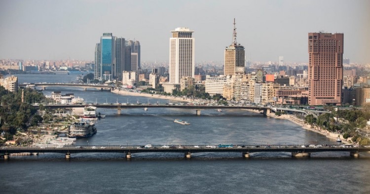 A complete overview of the Ramses Hilton Hotel (R), the Maspero Television Building (C) and the building of the Egyptian Ministry of Foreign Affairs with a view of the Qasr El Nil Bridge (front) on the banks of the Nile. 