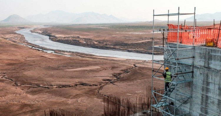 A worker goes down a construction ladder at the Grand Ethiopian Renaissance Dam (GERD), near Guba in Ethiopia, on December 26, 2019. 