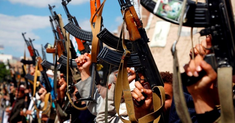 Houthi followers hold their guns during a tribal gathering against the continued war and blockade on October 03, 2019 in Sana'a, Yemen