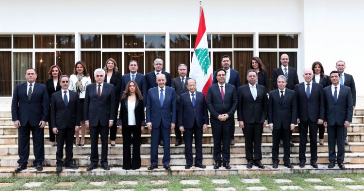 A handout picture provided by the Lebanese photo agency Dalati and Nohra shows Lebanon's Parliament Speaker Nabih Berri (C-L) and President Michel Aoun (C) and prime minister designate Hassan Diab (C-R) posing for a group photo with the newly formed government at the presidential palace in Baabda, east of the capital Beirut, on January 22, 2020.