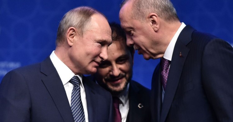 Russian President Vladimir Putin (L) and Turkish President Recep Tayyip Erdogan (R) speak as they attend an inauguration ceremony of a new gas pipeline "TurkStream" on January 8, 2020 in Istanbul. 