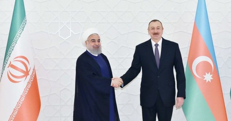  Iranian President Hassan Rouhani (L) meets President of Azerbaijan Ilham Aliyev (R) during his official visit in Baku, Azerbaijan on March 28, 2018. 