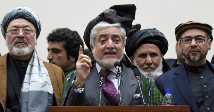 Afghan presidential election opposition candidate Abdullah Abdullah (C) gestures as he takes part in a press conference after the announcement of the final presidential elections results at the Sapedar Palace in Kabul on February 18, 2020. 