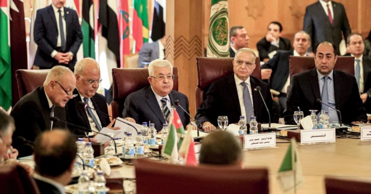 Palestinian president Mahmud Abbas (3rd-L) and Palestine Liberation Organisation (PLO) Secretary-General Saeb Erekat (2nd-L) look on as Arab League Secretary-General Ahmed Aboul Gheit (L) reads a statement during an Arab League emergency meeting discussing the US-brokered proposal for a settlement of the Middle East conflict, at the league headquarters in the Egyptian capital Cairo on February 1, 2020.