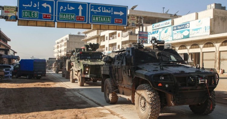 A Turkish military convoy of tanks and armoured vehicles passes through the Syrian town of Dana, east of the Turkish-Syrian border in the northwestern Syrian Idlib province, on February 2, 2020.