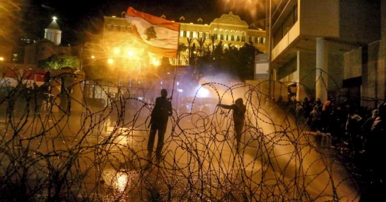 Riot policemen use water cannons to disperse anti-government protesters during clashes near the Grand Serail, headquarters of the Prime Minister of Lebanon. Photo: Marwan Naamani/dpa (Photo by Marwan Naamani/picture alliance via Getty Images)