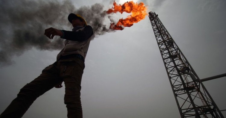 An employee walks at the Hammar Mushrif new Degassing Station Facilities site inside the Zubair oil and gas field, north of the southern Iraqi province of Basra on May 9, 2018. (Photo by HAIDAR MOHAMMED ALI / AFP) (Photo credit should read HAIDAR MOHAMMED ALI/AFP via Getty Images)